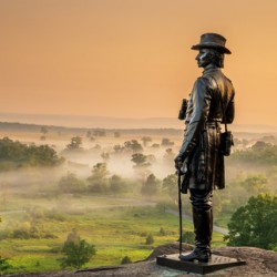 Dawns Embrace: A Vibrant Sunrise at General Warren Monument in Gettysburg