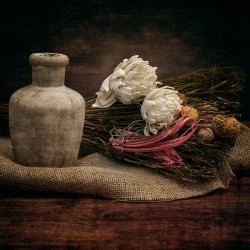 Rustic Elegance: Old Wooden Jar on Burlap with Flowers Reeds