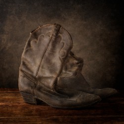 Worn Elegance: Weathered Cowboy Boots in Rustic Splendor