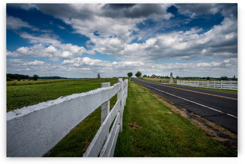 Fence along the road by Dream World Images