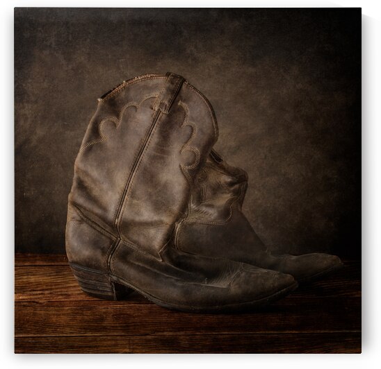 Worn Elegance: Weathered Cowboy Boots in Rustic Splendor by Dream World Images